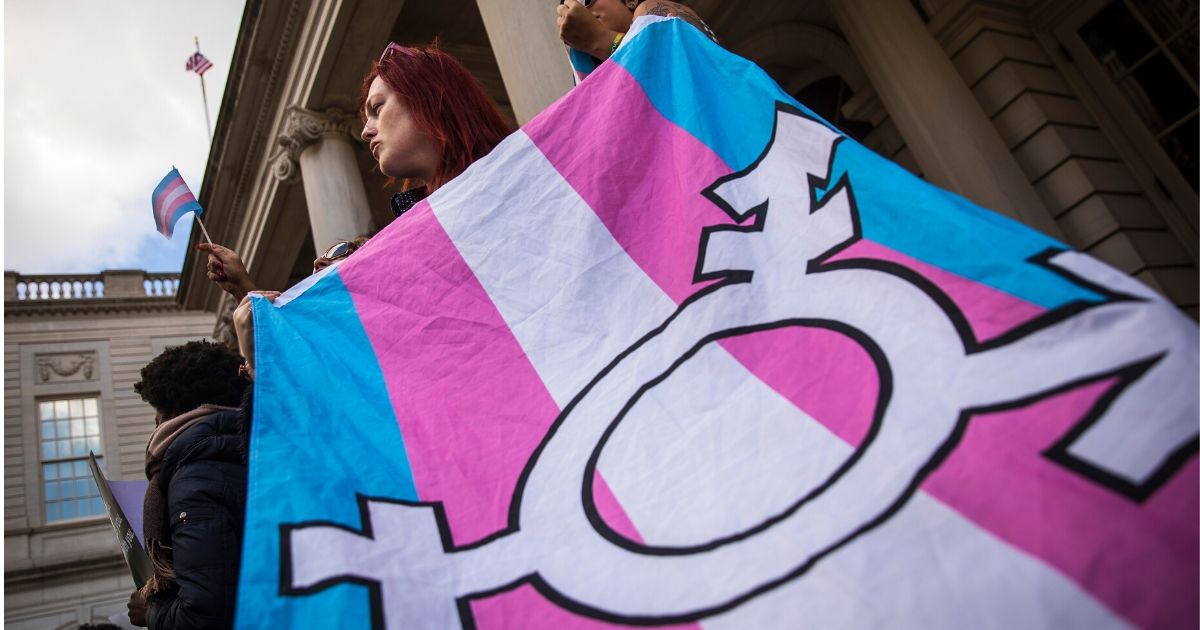 LGBT activists rally in support of transgender people on the steps of New York City Hall on Oct. 24, 2018, in New York City.