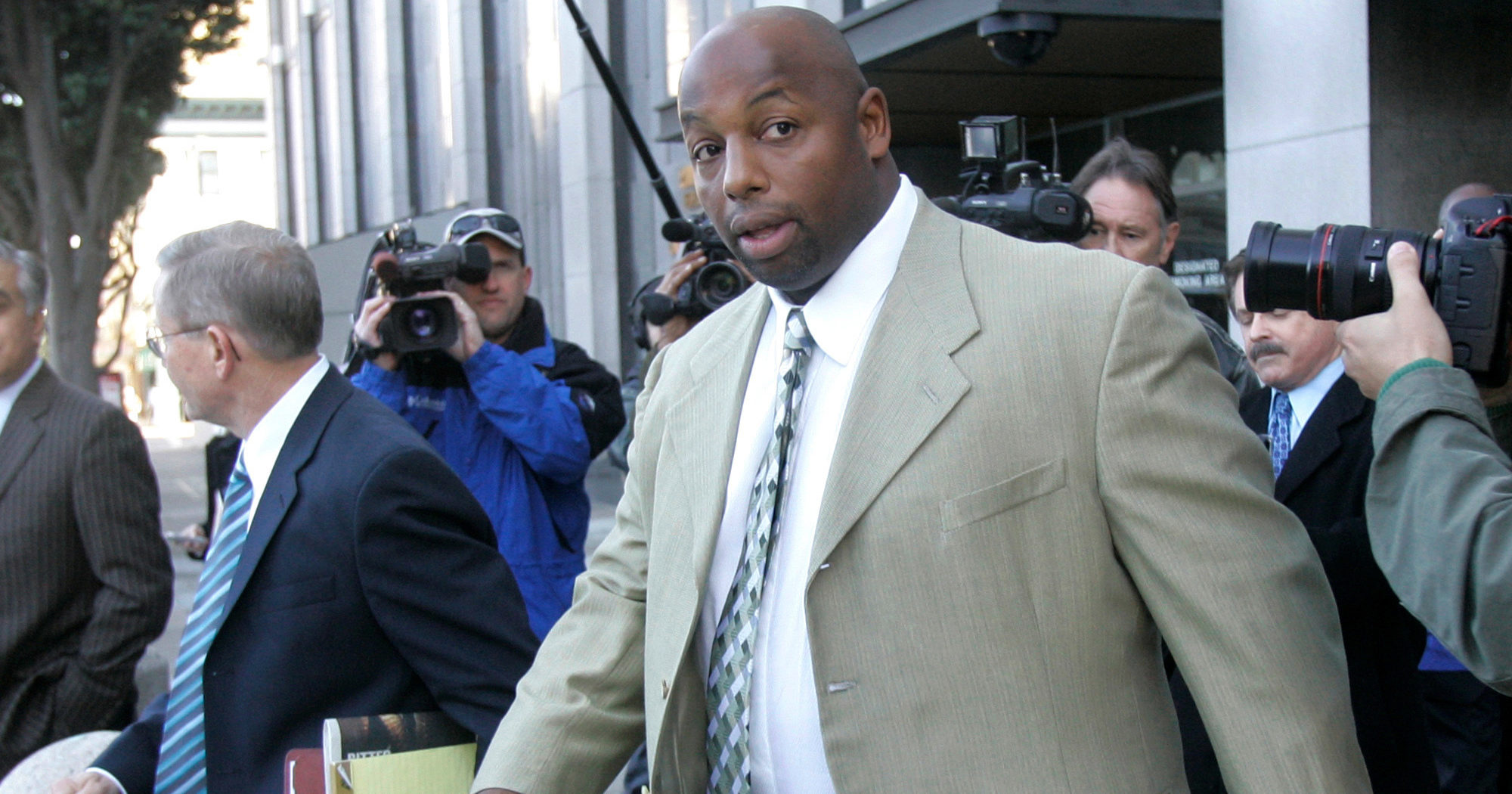 In this Jan. 18, 2008, file photo, former NFL football player Dana Stubblefield leaves a federal courthouse in San Francisco. Stubblefield was convicted July 27, 2020, of the rape of a developmentally disabled woman after, prosecutors said, he lured the victim to his home with the promise of a babysitting job. A jury found Stubblefield, 49, guilty of rape by force, oral copulation by force and false imprisonment, and acquitted him of raping a person incapable of giving consent, the San Francisco Chronicle reported. Jurors also found that Stubblefield used a gun during the assault, prosecutors said.