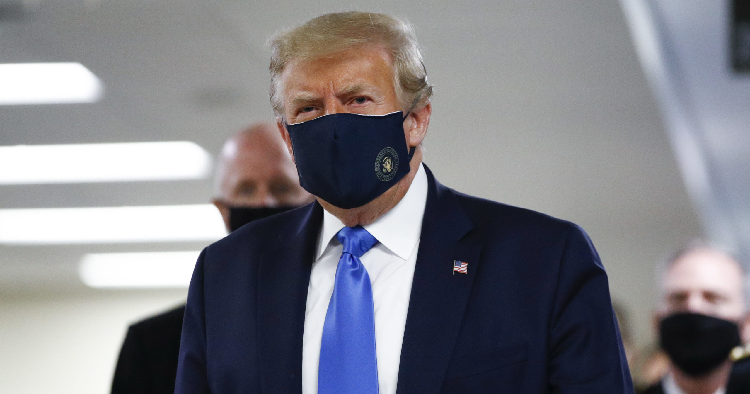 President Donald Trump wears a mask as he walks down the hallway during his visit to Walter Reed National Military Medical Center in Bethesda, Maryland, on July 11, 2020.