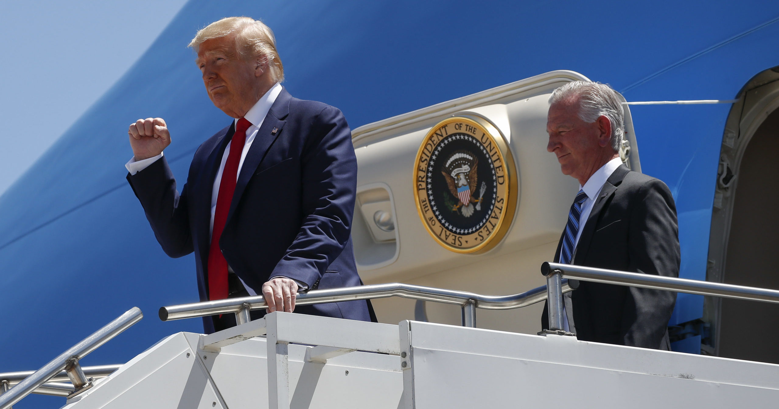 In this June 11, 2020, file photo, President Donald Trump gestures as he steps off Air Force One at Dallas Love Field in Dallas with Senate candidate Tommy Tuberville. Trump has endorsed Tuberville in the race against his former attorney general.