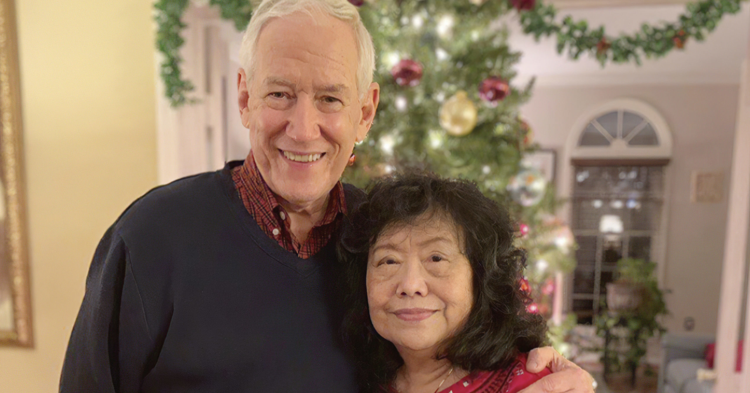 In this December, 2018, photo released by the Stemberger family, Victor and his wife Han Stemberger are shown at their home in Centreville, Virginia.