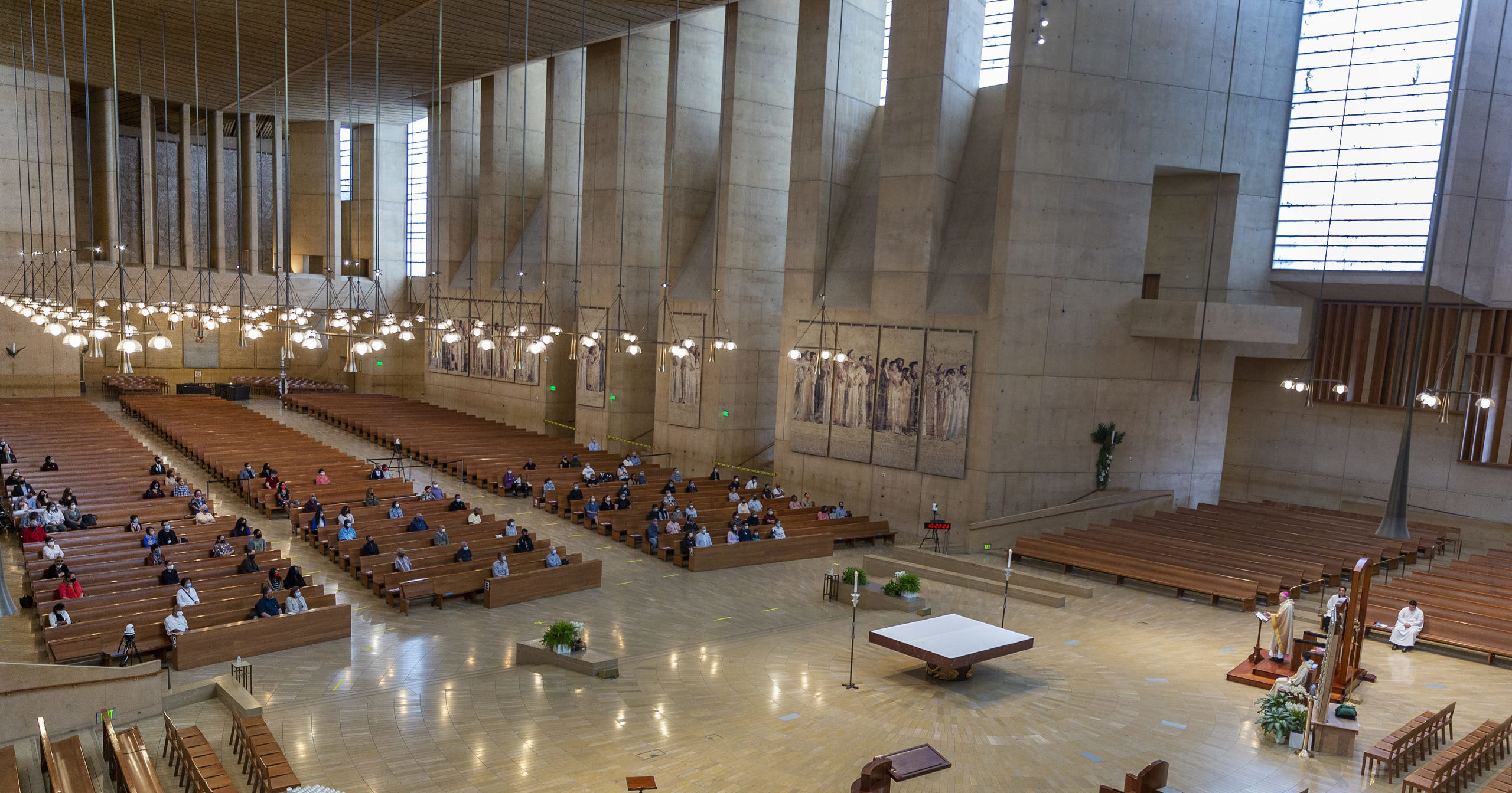 Los Angeles Archbishop Jose H. Gomez celebrates mass in Los Angeles on June 7, 2020. A religious freedom law firm with ties to President Donald Trump says it will sue California over its recent ban on singing or chanting in church.