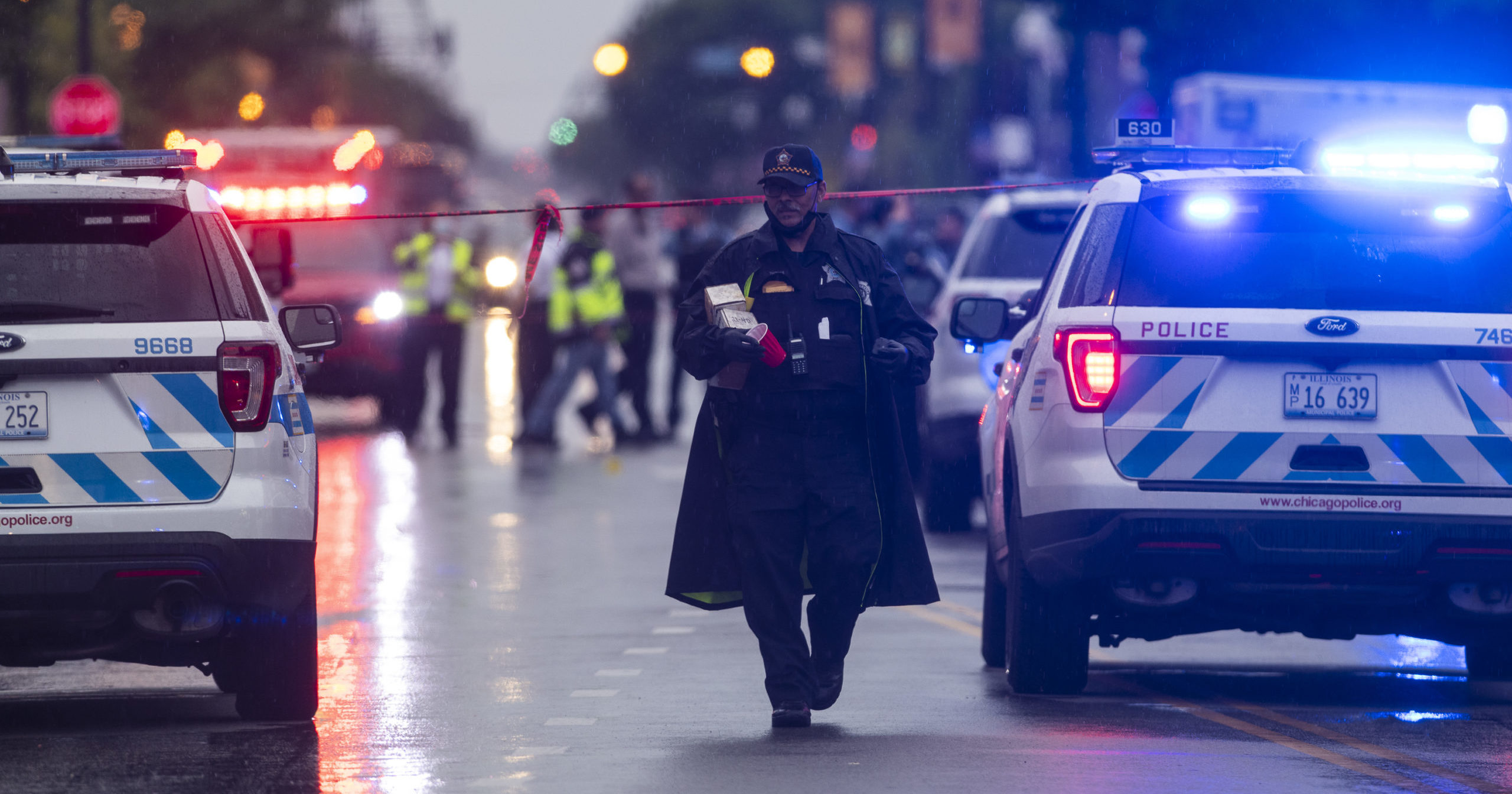 Chicago police investigate the scene of a shooting where more then a dozen people were shot in the Gresham neighborhood of Chicago on July 21, 2020.