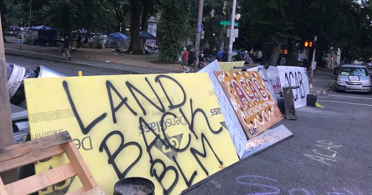 Barriers painted with anti-police slogans were set up in Portland, Oregon.