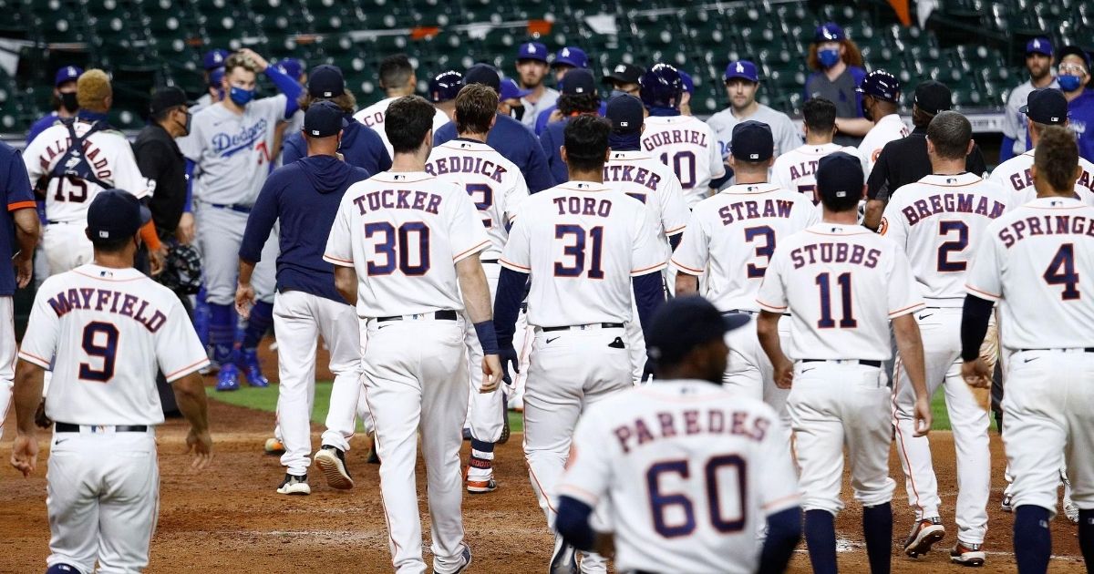 Both teams' benches empty after Joe Kelly of the Los Angeles Dodgers threw several high inside pitches to the Houston Astros' Alex Bregman and Carlos Correa in a game at Minute Maid Park on July 28, 2020.