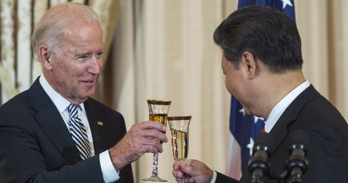 Then-Vice President Joe Biden toasts Chinese President Xi Jinping during a luncheon at the Department of State in Washington on Sept. 25, 2015