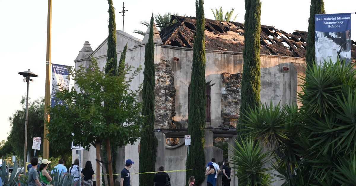 The damaged roof of the San Gabriel Mission is seen after a fire broke out early on July 11, 2020, in San Gabriel, California.