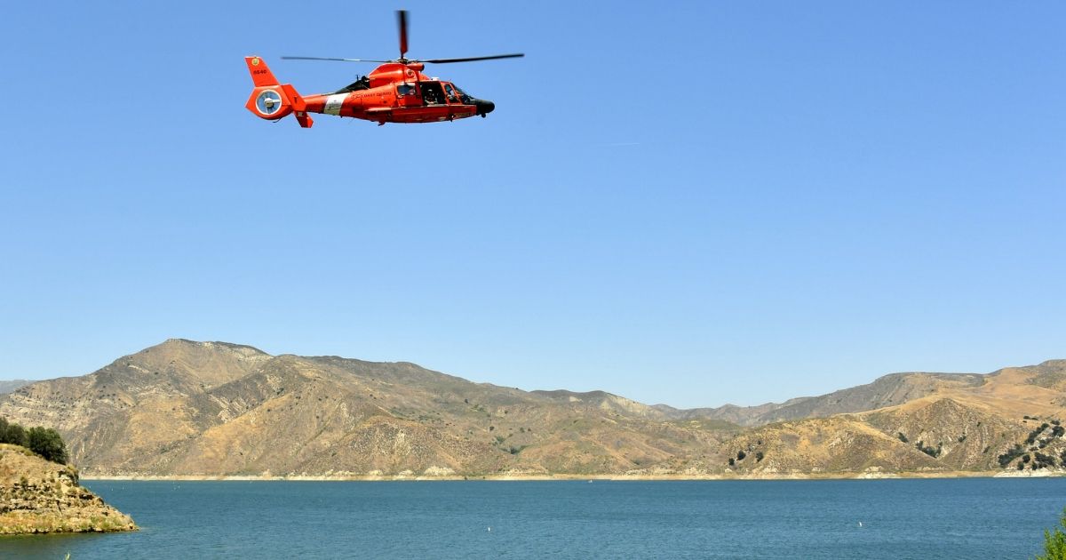 A U.S. Coast Guard helicopter flies over Lake Piru, where actress Naya Rivera was reported missing Wednesday, on July 9, 2020 in Piru, California.