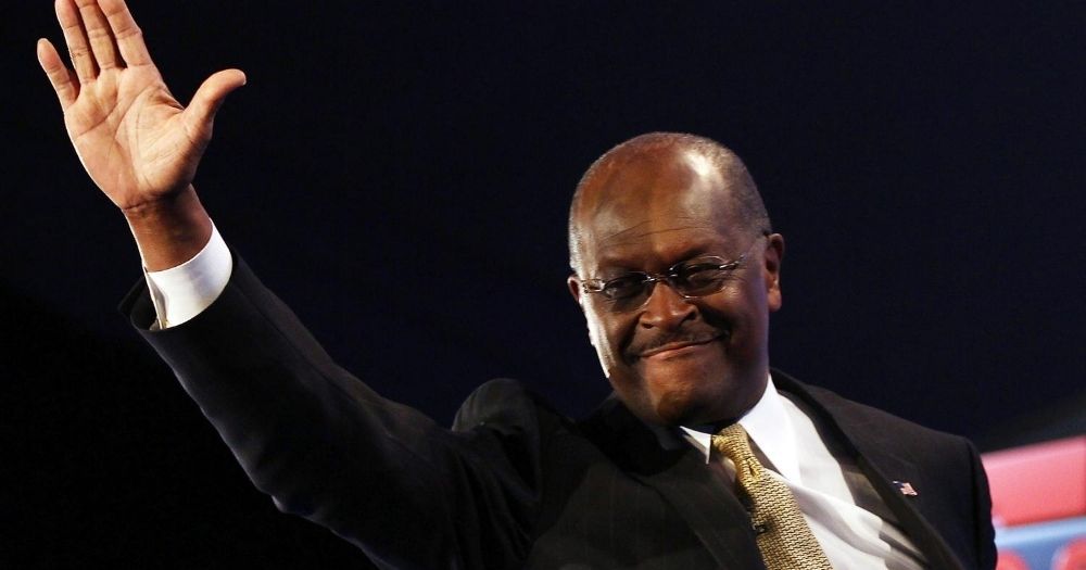 Then-Republican presidential candidate and former CEO of Godfather's Pizza Herman Cain is introduced prior to a debate at Constitution Hall on Nov. 22, 2011, in Washington, D.C.
