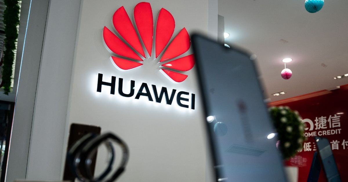 A Huawei logo is displayed at a retail store in Beijing on May 20, 2019.