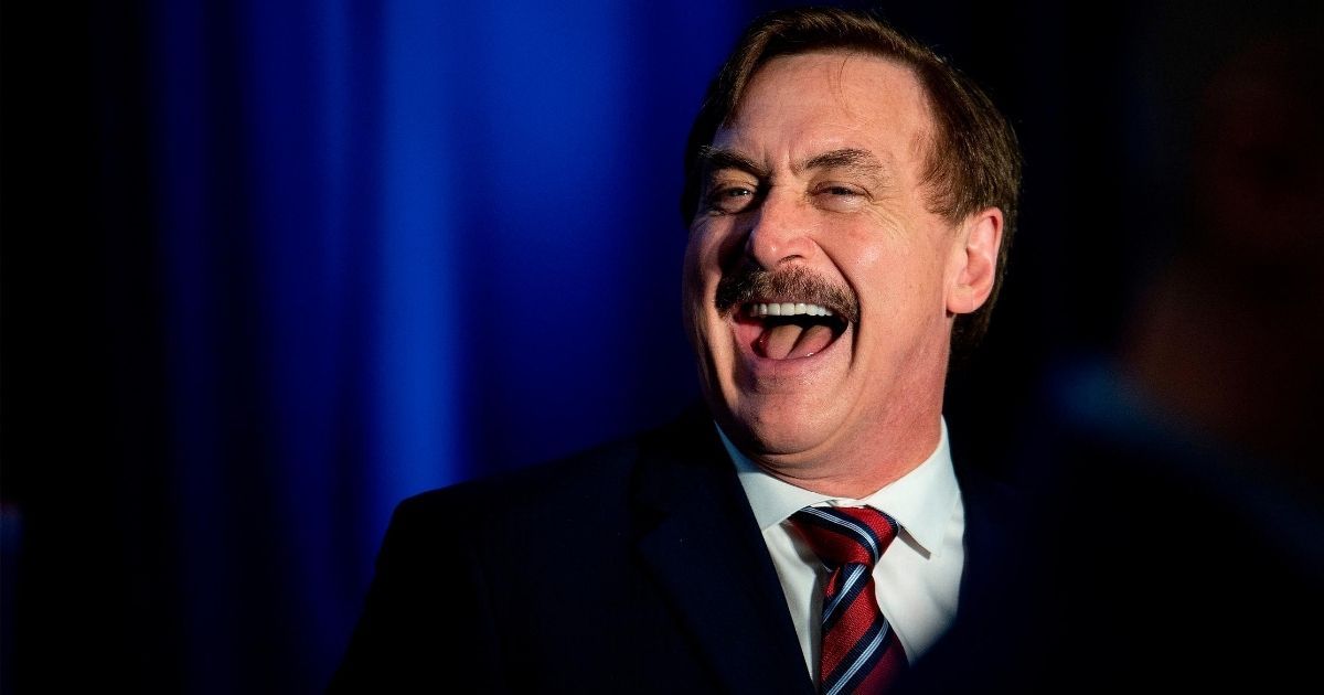 MyPillow CEO Michael Lindell laughs during a news conference in Des Moines, Iowa, on Feb. 3, 2020.