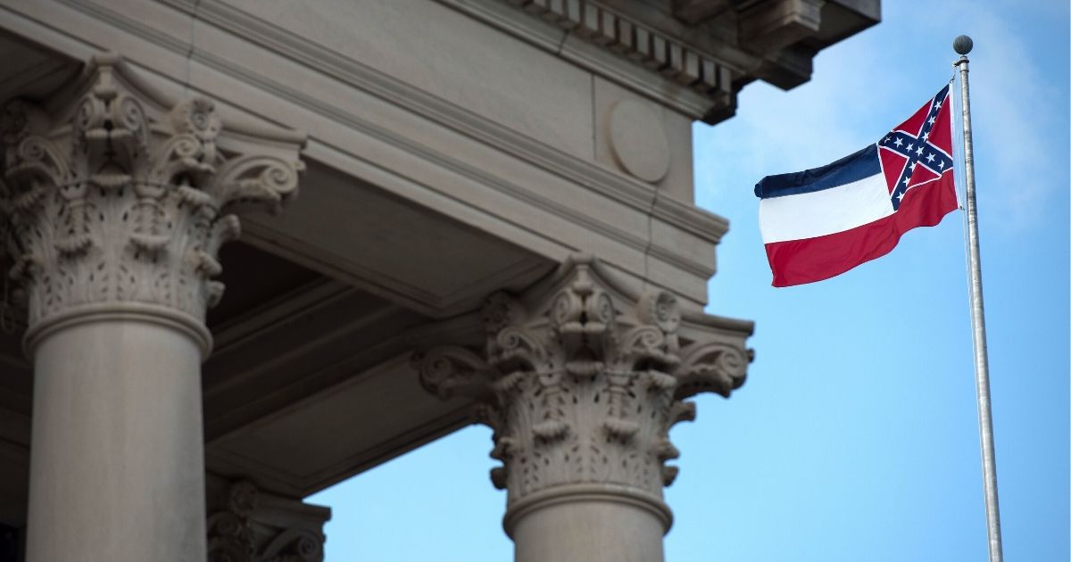 The outgoing Mississippi state flag flies outside the State Capitol building in Jackson on June 28, 2020.
