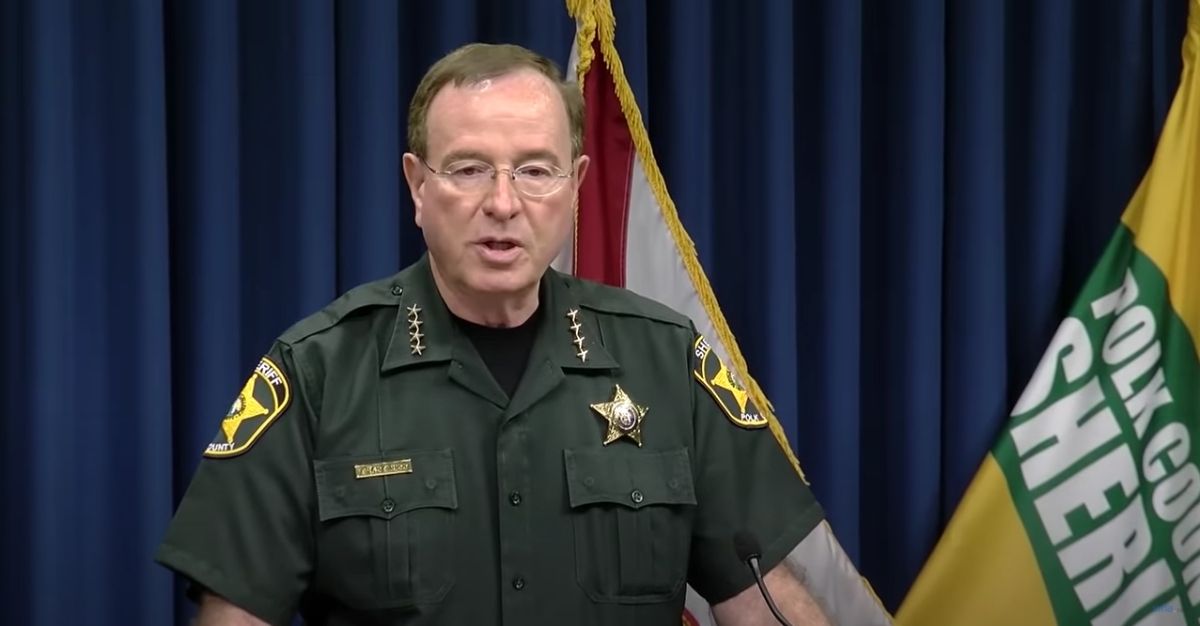 Polk County Sheriff Grady Judd speaks in a news conference about the suspects of the murder of three men at a Florida lake.