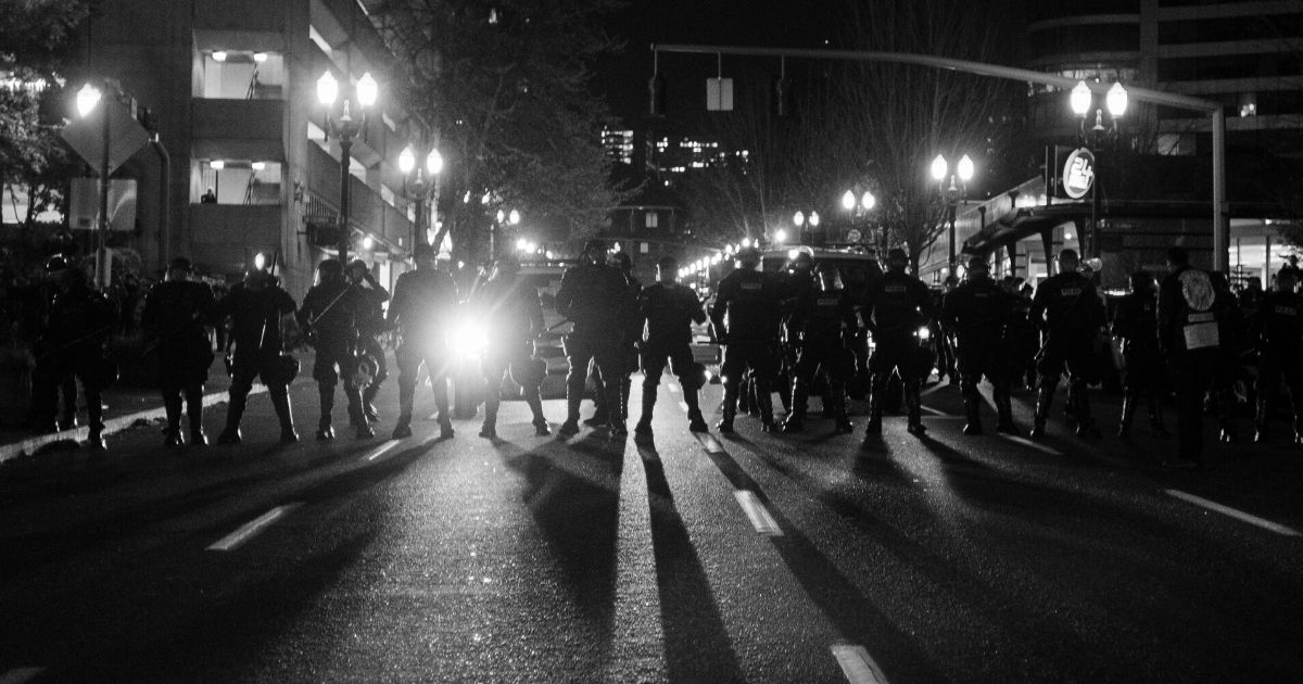 Line of Portland police officers in riot gear.