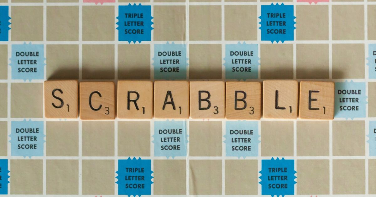 A Scrabble board is seen in the stock image above.