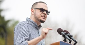 Shaun King introduces then-Democratic presidential candidate Bernie Sanders on May 25, 2019, in Montpelier, Vermont.