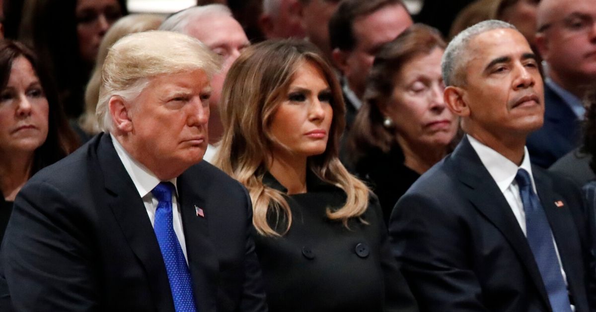 Trump, Melania and Obama listen in at a state funeral held for George H.W. Bush at the Washington National Cathedral on Dec. 5, 2018.