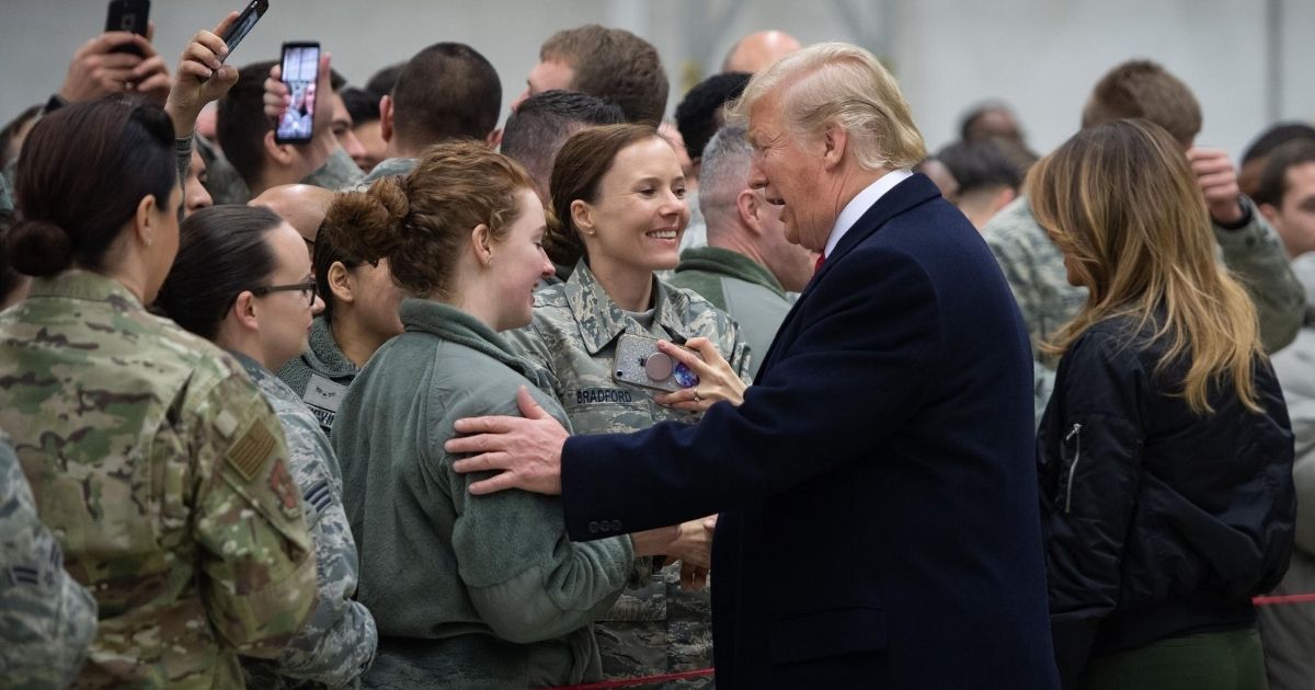 President Donald Trump and first lady Melania Trump greet U.S. troops during a stop at Ramstein Air Base in Germany on Dec. 27, 2018.