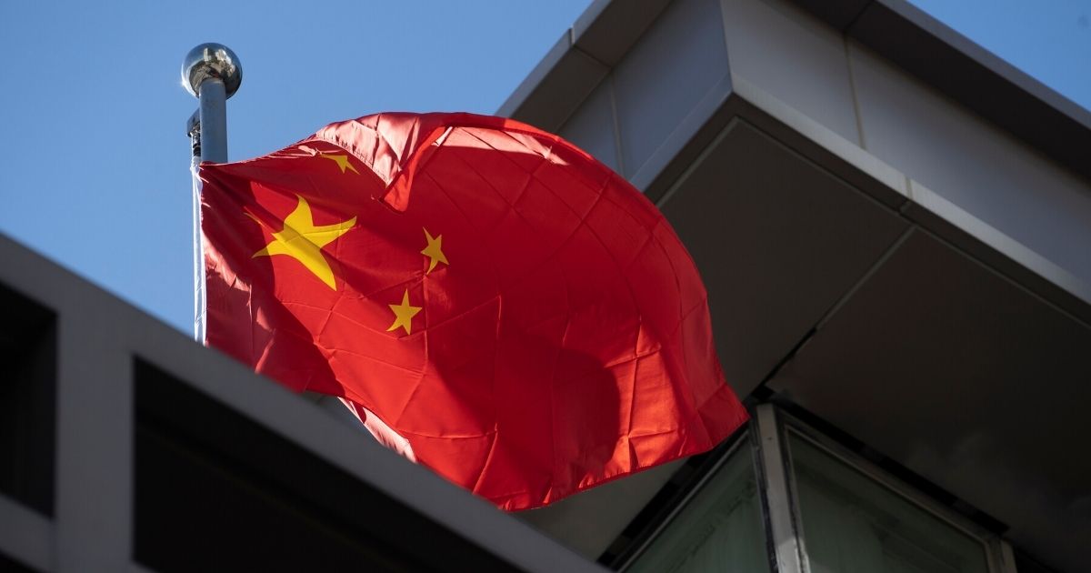 A Chinese national flag waves at the Chinese consulate after the United States ordered China to close its doors on July 22, 2020, in Houston, Texas.