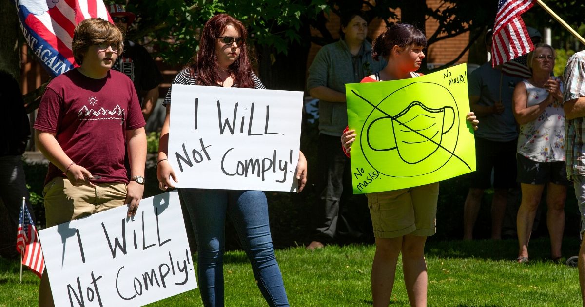 Protesters rally against the Washington state mask mandate outside the Clark County Sheriffs Office in Vancouver on June 26, 2020.