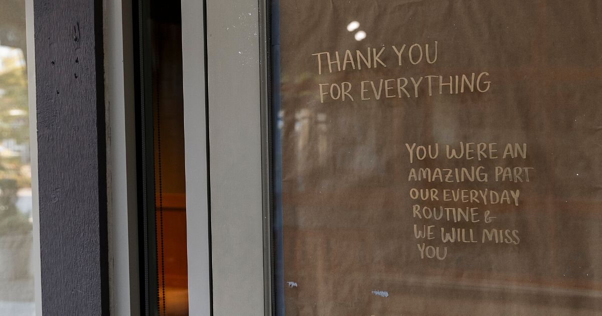 A note reading "Thank You For Everything" is displayed on the door of a permanently closed Starbucks Coffee shop in Dundarave Village Mews on May 15, 2020, in West Vancouver, British Columbia, Canada.