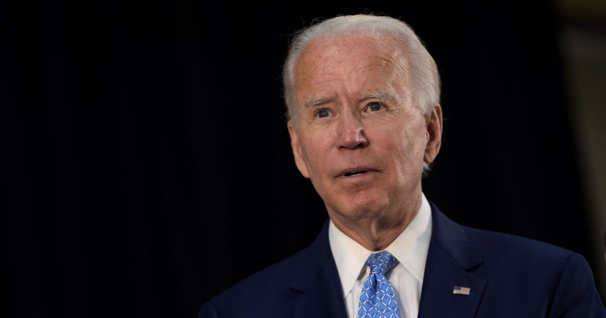 Presumptive Democratic presidential nominee Joe Biden answers questions after speaking about the coronavirus pandemic and the economy on June 30, 2020, in Wilmington, Delaware.