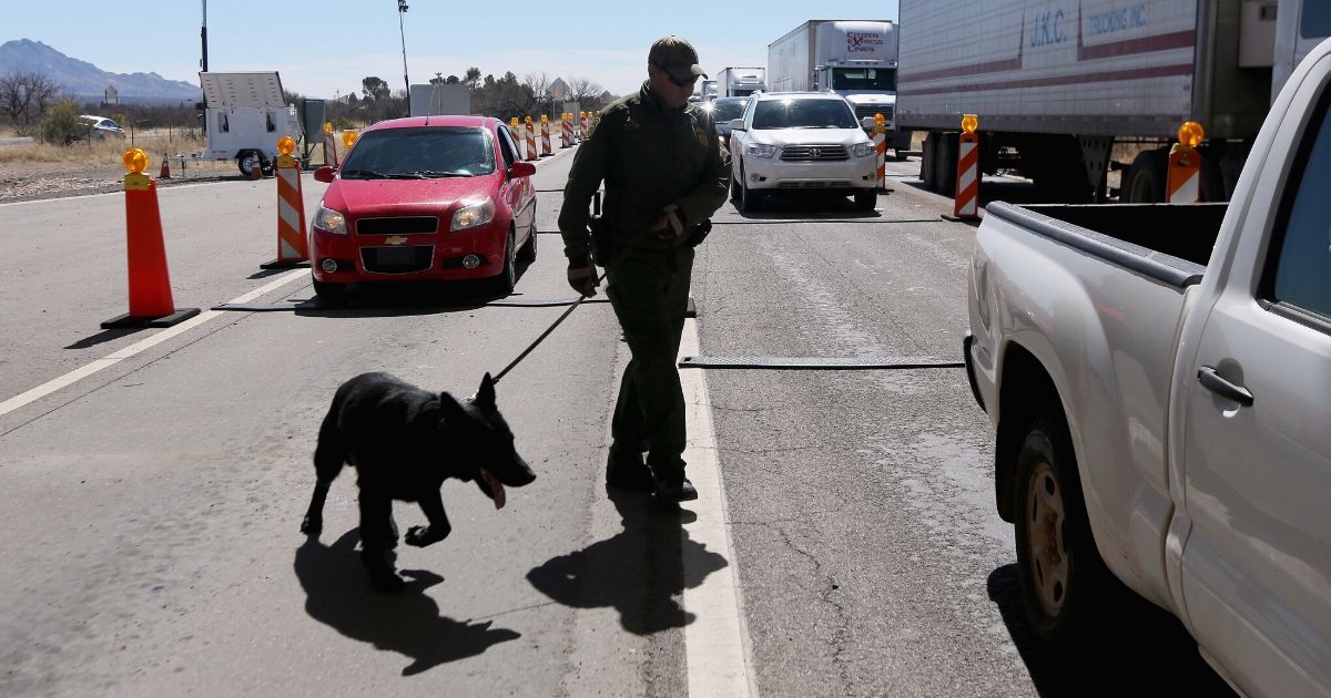 A Border Patrol agent works a checkpoint at the U.S.-Mexico border north of Nogales, Arizona, in a 2013 file photo.
