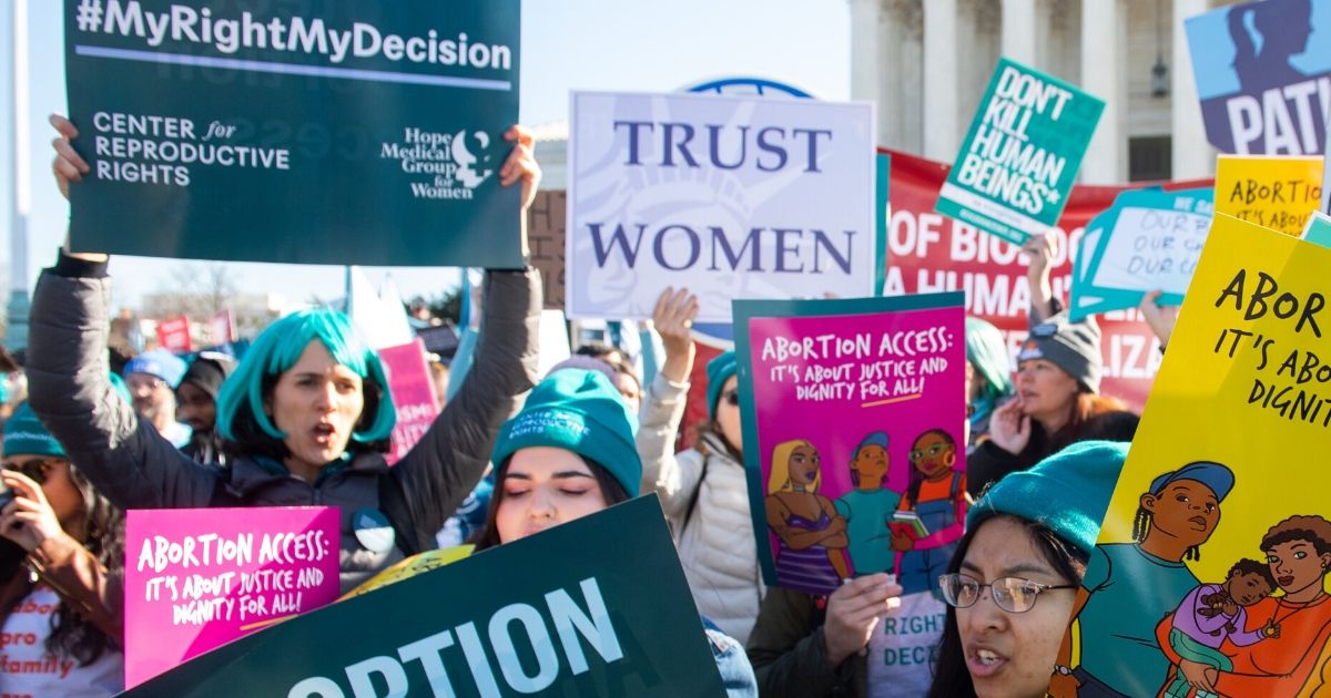 Pro-abortion activists protest during a demonstration outside the Supreme Court in Washington, D.C., on March 4, 2020.