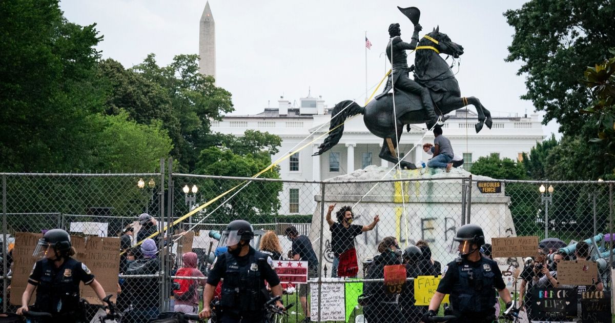 A mob of vandals tries to pull down the statue of Andrew Jackson in Lafayette Square near the White House on June 22.