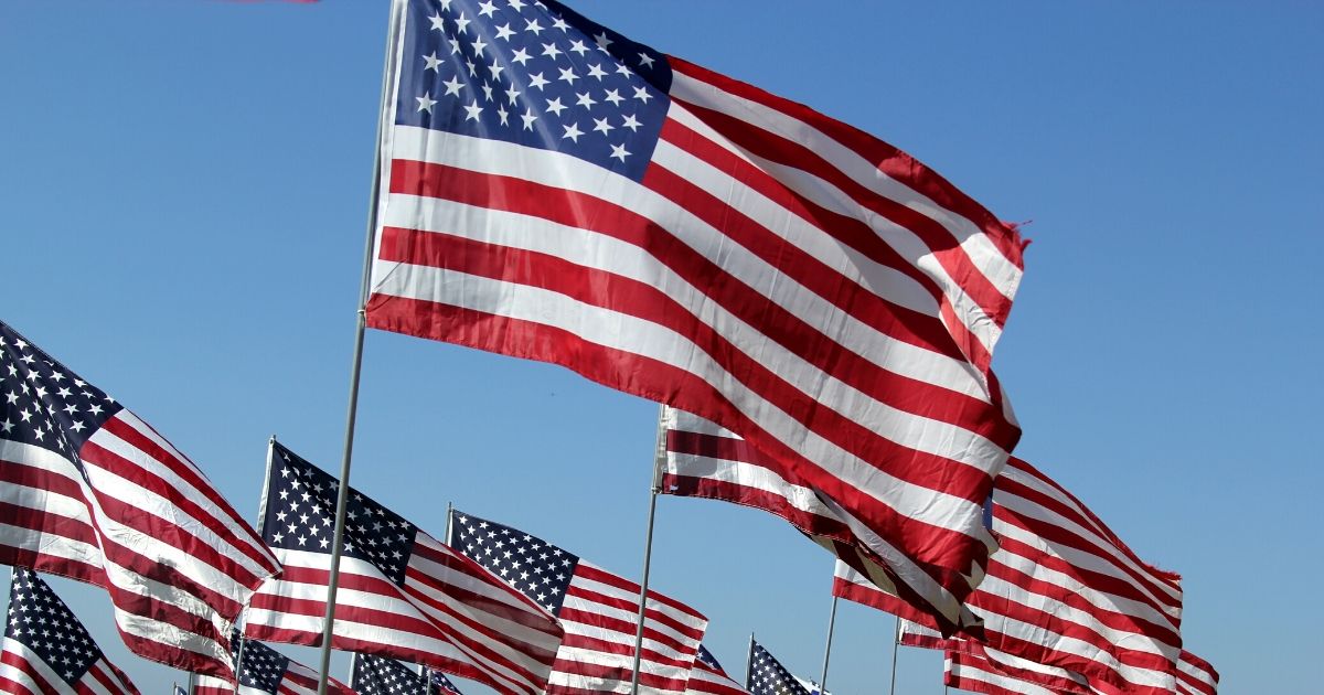 American flags flutter in the wind.