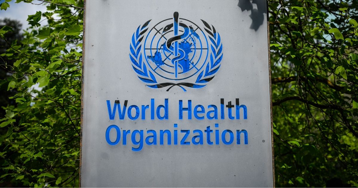 This picture taken on April 24, 2020, shows a sign of the World Health Organization in Geneva next to its headquarters.