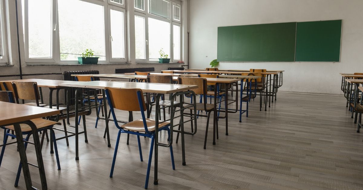 A classroom full of empty desks.