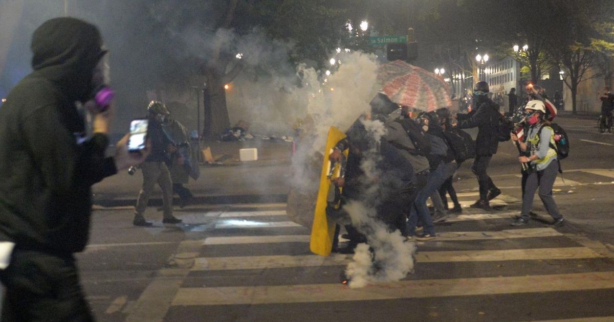 Protesters carry shields in Portland, Oregon, on July 23, 2020.