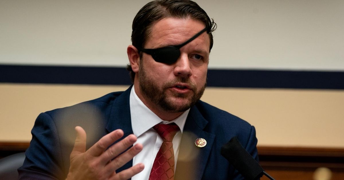 U.S. Rep. Dan Crenshaw, pictured at a July 22 hearing on Capitol Hill.