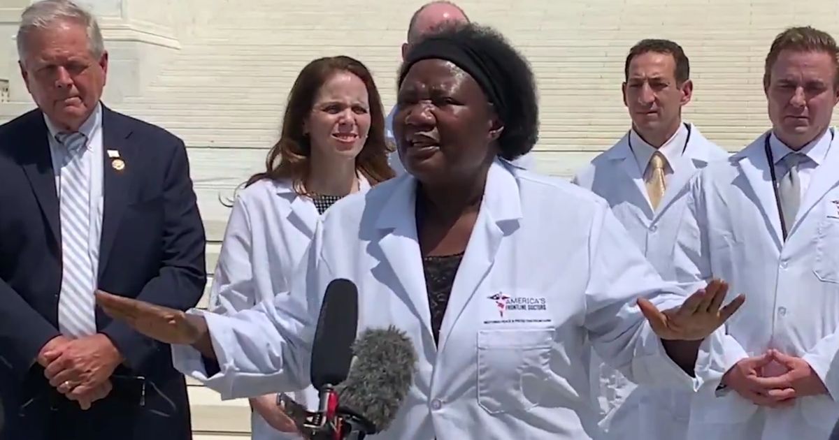 Dr. Stella Immanuel of America's Frontline Doctors speaks in front of the steps of the Supreme Court in Washington, D.C.