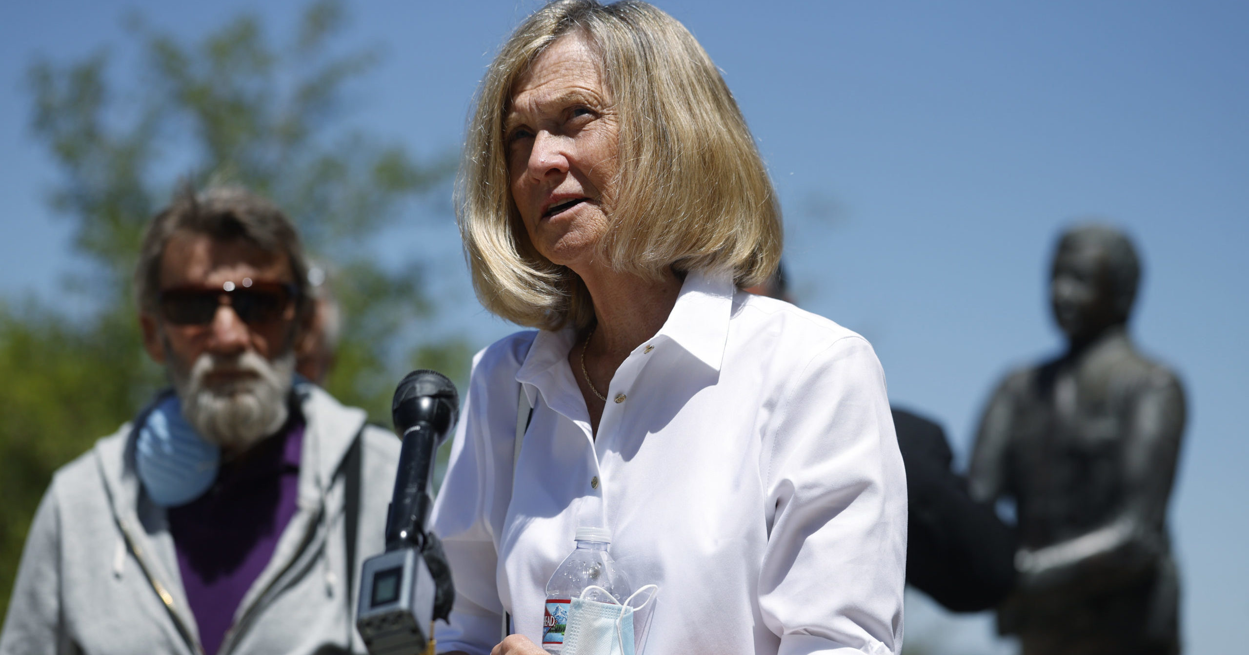 Janet Johnson of Pawcatuck, Connecticut, front, speaks at a press conference after the sentencing hearing on July 1, 2020, for James Curtis Clanton in the death of Helene Pruszynski, Johnson's younger sister, four decades ago in Castle Rock, Colorado. Clanton has been sentenced to life in prison.