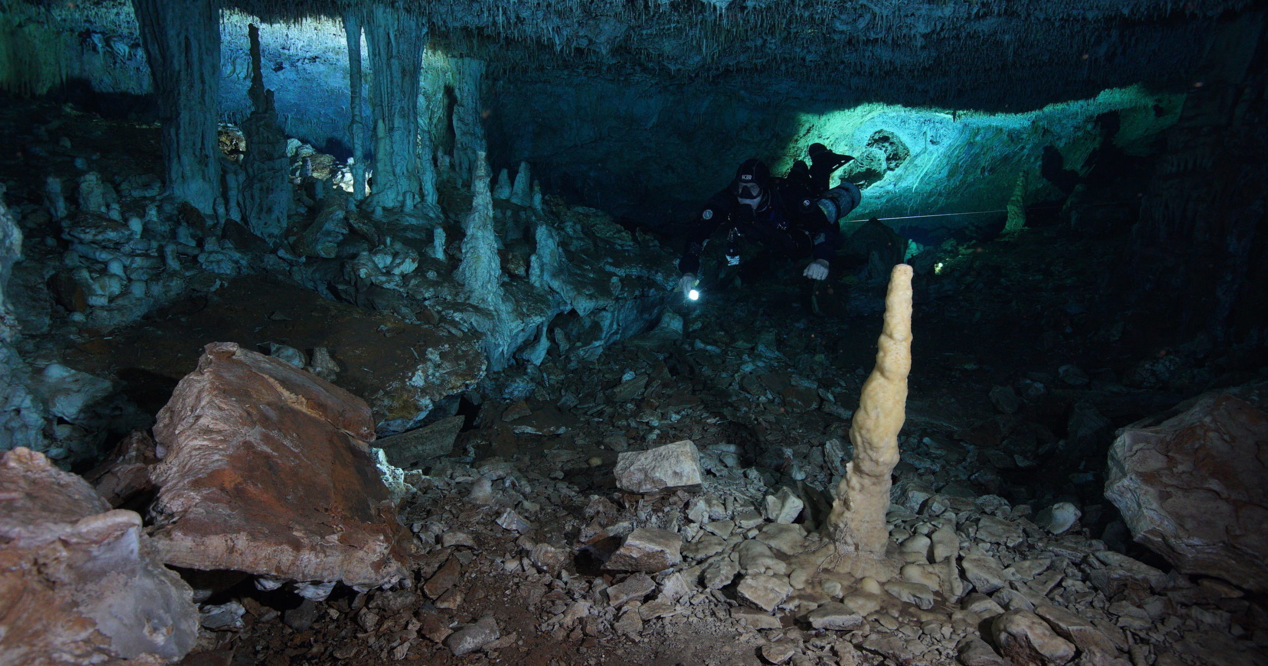 This Dec. 12, 2019, photo released by CINDAQ shows a diver in the "La Mina Roja" passage of the Sagitario underwater cave system in Mexico's Yucatan Peninsula.