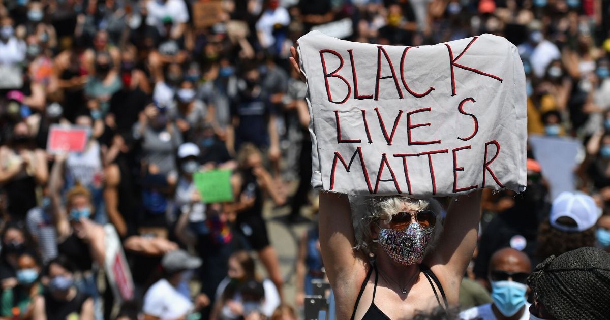 A protester holds a "Black Lives Matter" sign on June 19, 2020, in New York City.