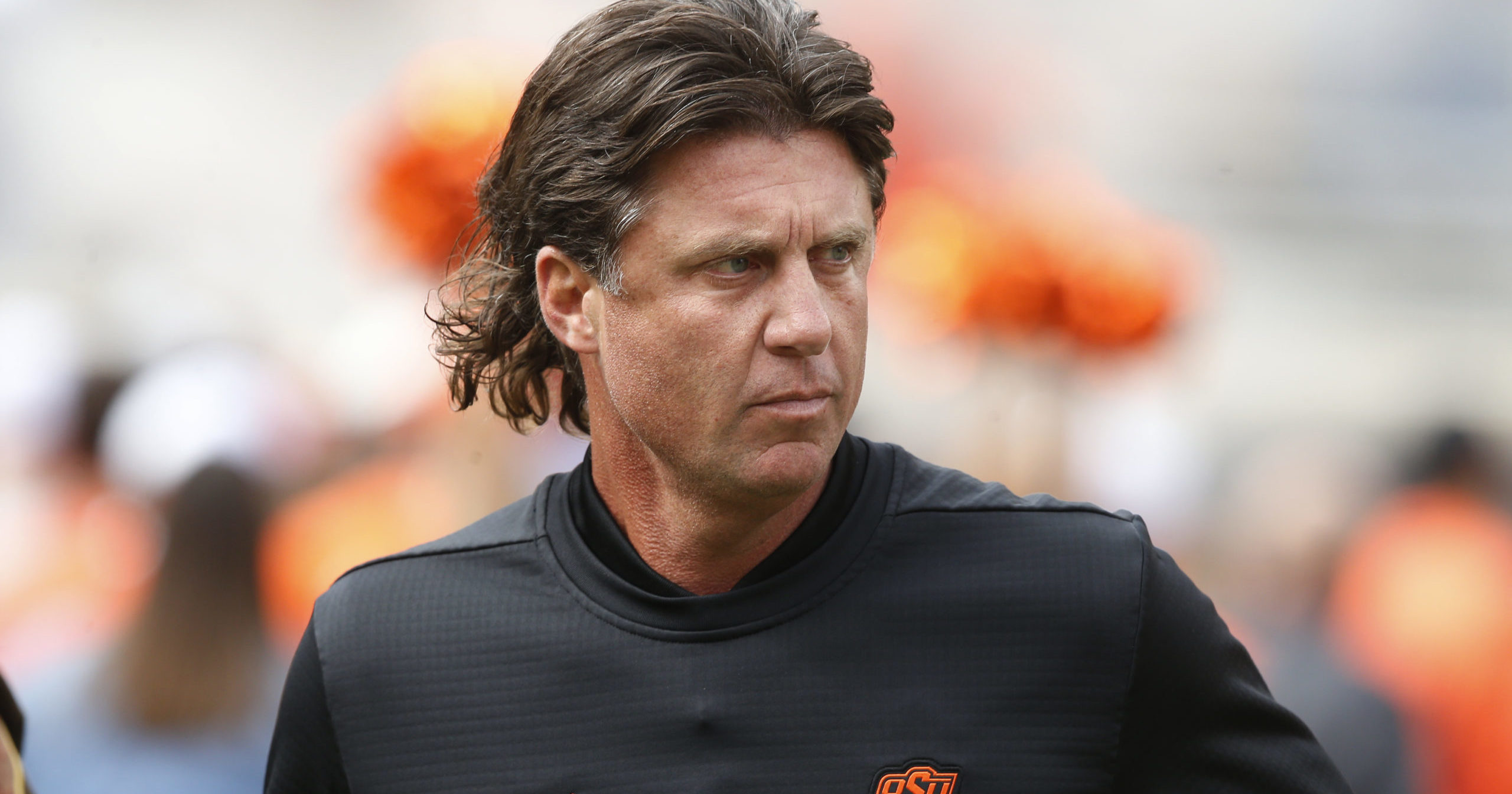 In this Oct. 6, 2018, file photo, Oklahoma State football coach Mike Gundy runs onto the field before the team's game against Iowa State in Stillwater, Oklahoma. Mike Holder, Oklahoma State’s athletic director, said on July 2, 2020, that an internal review had found “no sign or indication of racism” in the football program under Gundy.