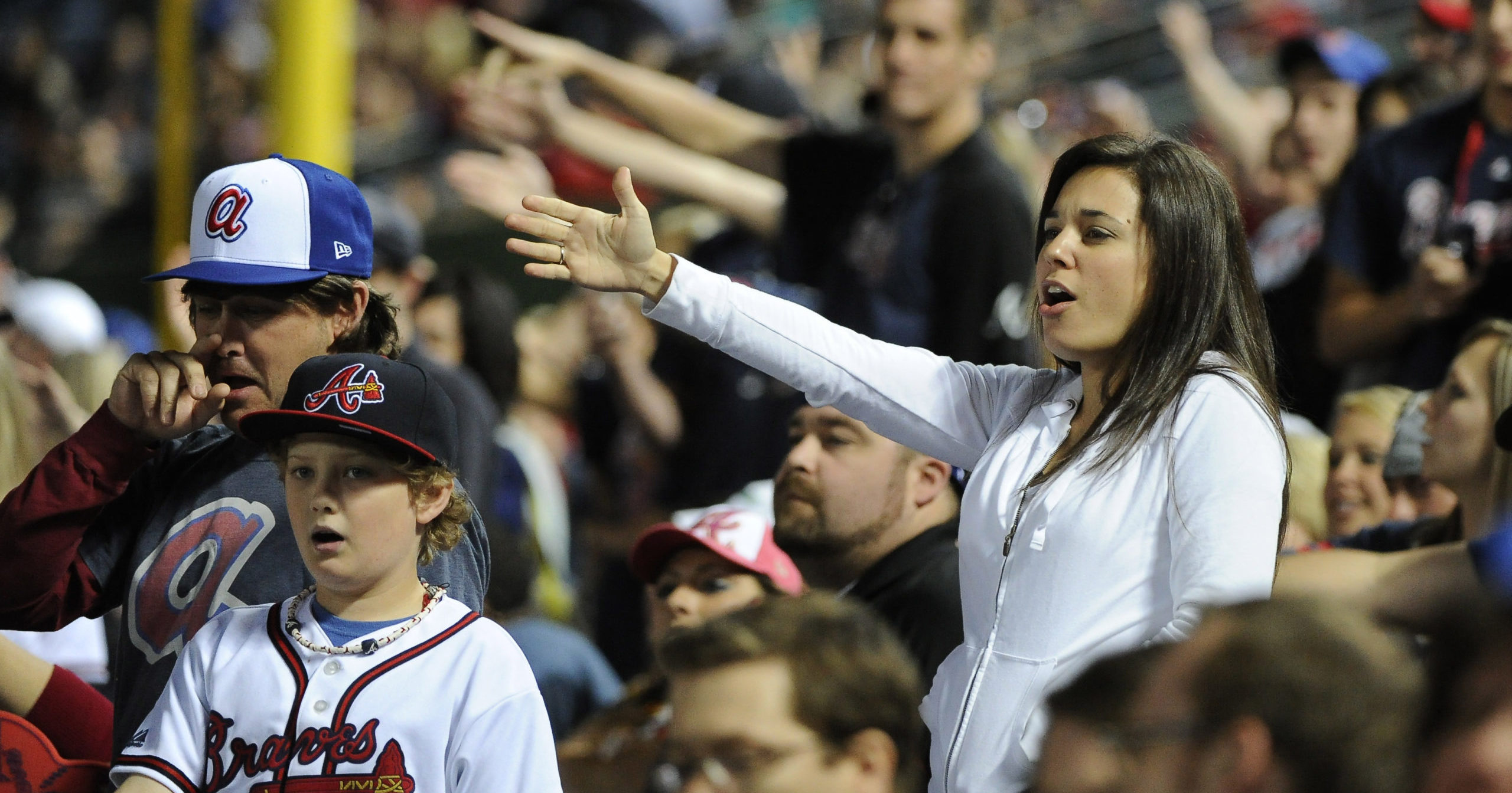 Braves fans do the tomahawk chop during a May 2, 2014, game against the San Francisco Giants in Atlanta.