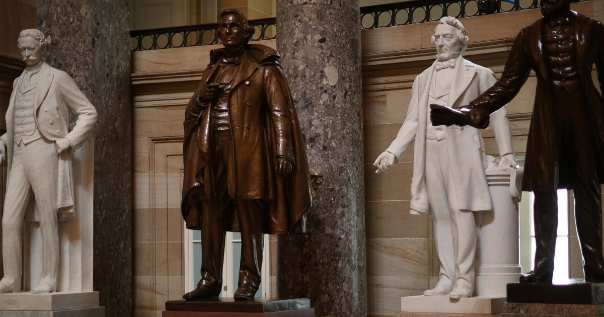 Statues of Jefferson Davis, president of the Confederate States, and Uriah M. Rose, an Arkansas county judge and supporter of the Confederacy, are on display in Statuary Hall inside the U.S. Capitol on June 18, 2020, in Washington, D.C.