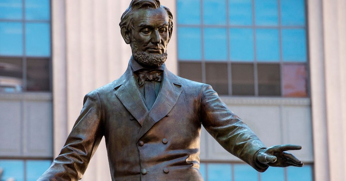 A statue of Abraham Lincoln, erected in 1879, by Thomas Ball, is viewed in Park Square in Boston, Massachusetts, on June 16, 2020. The statue is a copy of the Emancipation Memorial in Washington, D.C. and represents Lincoln freeing African-American slaves at the end of the Civil War.