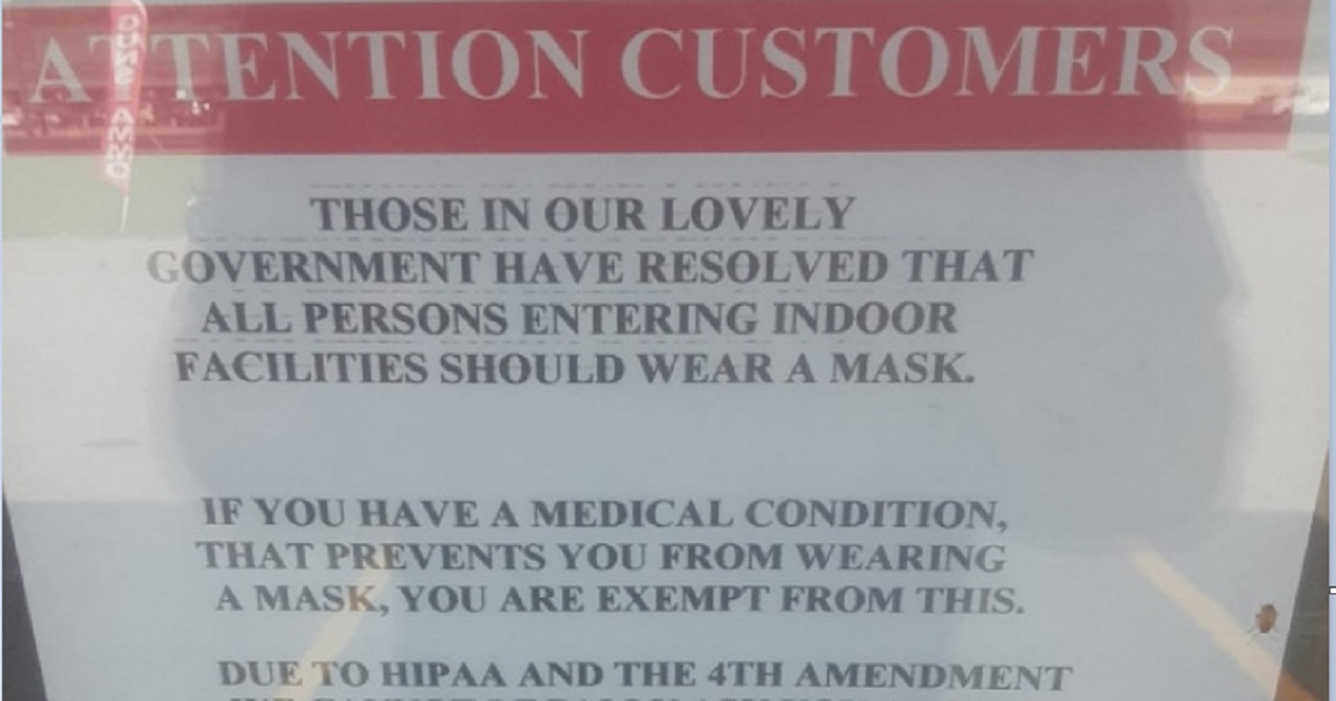 A sign on the door of an Arkansas gun shop tells customers they don't have to wear a mask if they have a "medical condition."