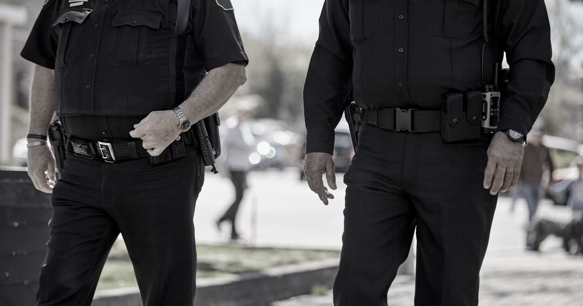 Police officers are seen in the stock image above.