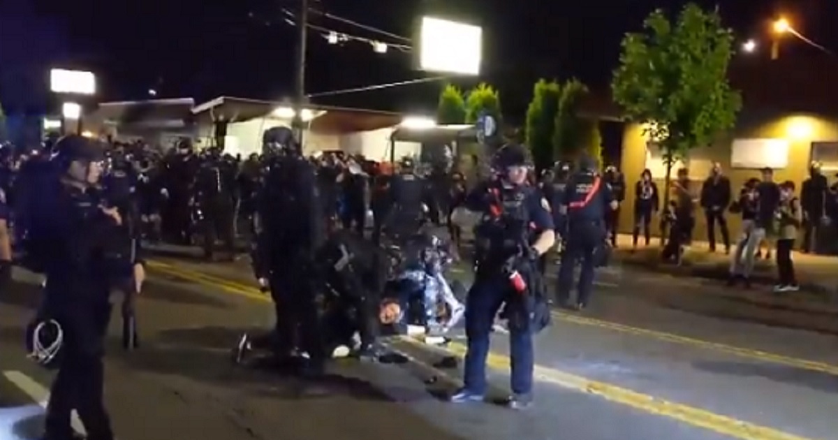 Portland police face off against demonstrators Tuesday night.