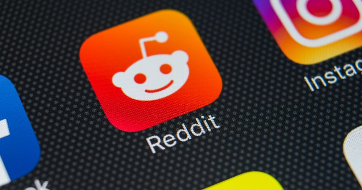 The Reddit app is seen on a phone screen in this stock image.
