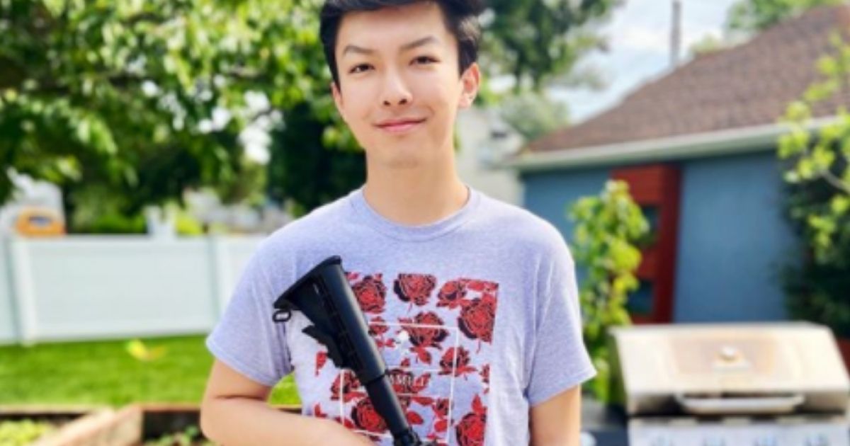 Fordham University student Austin Tong holds an AR-15 in this photo shared on Instagram.
