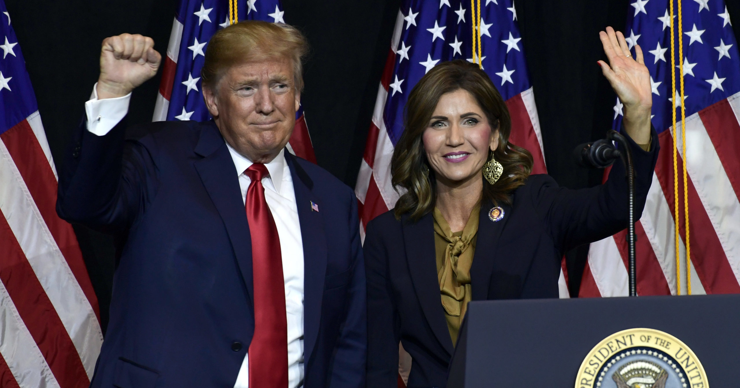 In this Sept. 7, 2018, file photo, President Donald Trump appears with Gov. Kristi Noem in Sioux Falls, South Dakota. Officials said on Aug. 12, 2020, that they plan to erect a security fence around the official governor’s residence to protect Noem.