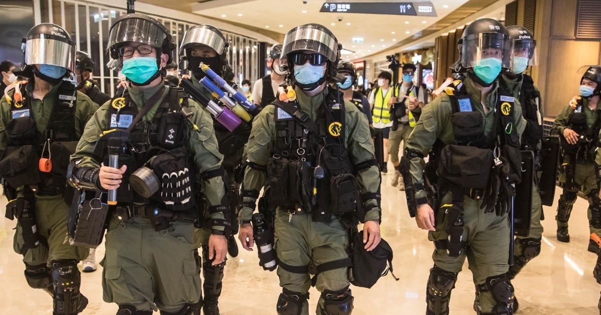Riot police secure a shopping mall after prostesters gathered to mark one year since a group of white-clad men attacked pro-democracy protesters who were returning home from protests at the nearby Yuen Long train station, in Hong Kong on July 21, 2020.