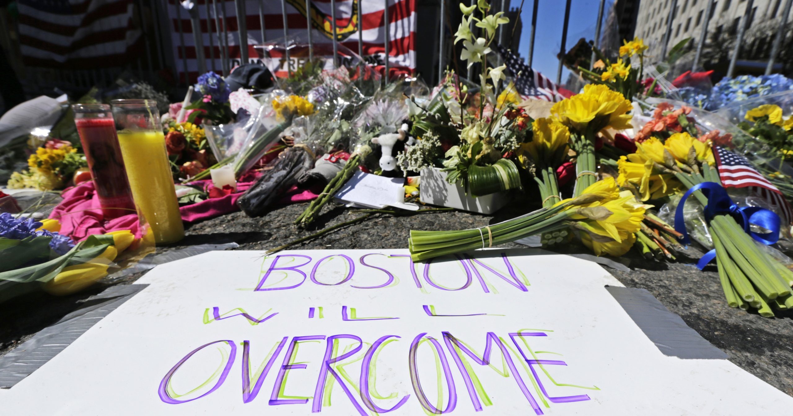 In this April 17, 2013, photograph, flowers and signs adorn a makeshift memorial two days after two explosions killed three and injured hundreds near the of finish line of the Boston Marathon. A federal appeals court overturned the death sentence of Dzhokhar Tsarnaev in the 2013 bombing on July 31, 2020, saying the judge who oversaw the case didn't adequately screen jurors for potential biases.